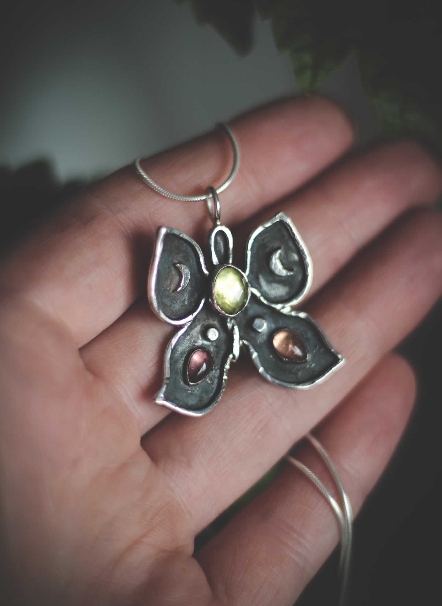 Butterfly necklace with Peridot and Tourmaline.