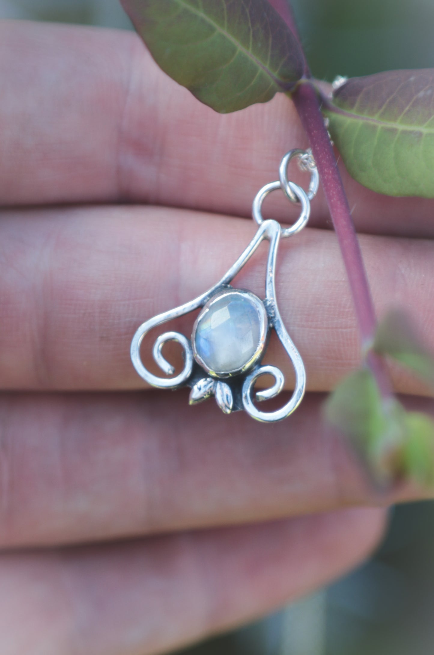 Moonstone flourish necklace.
