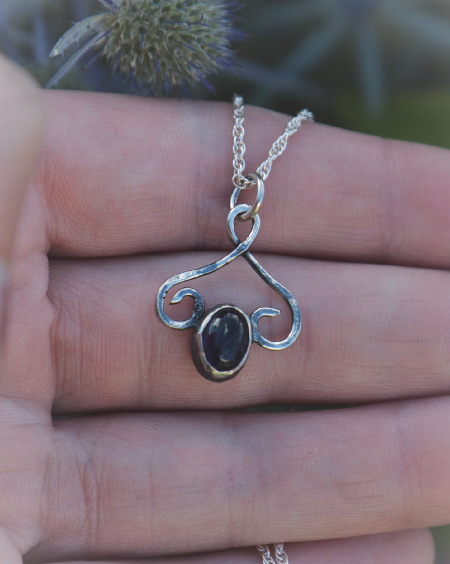 Dark Amethyst flourish necklace.