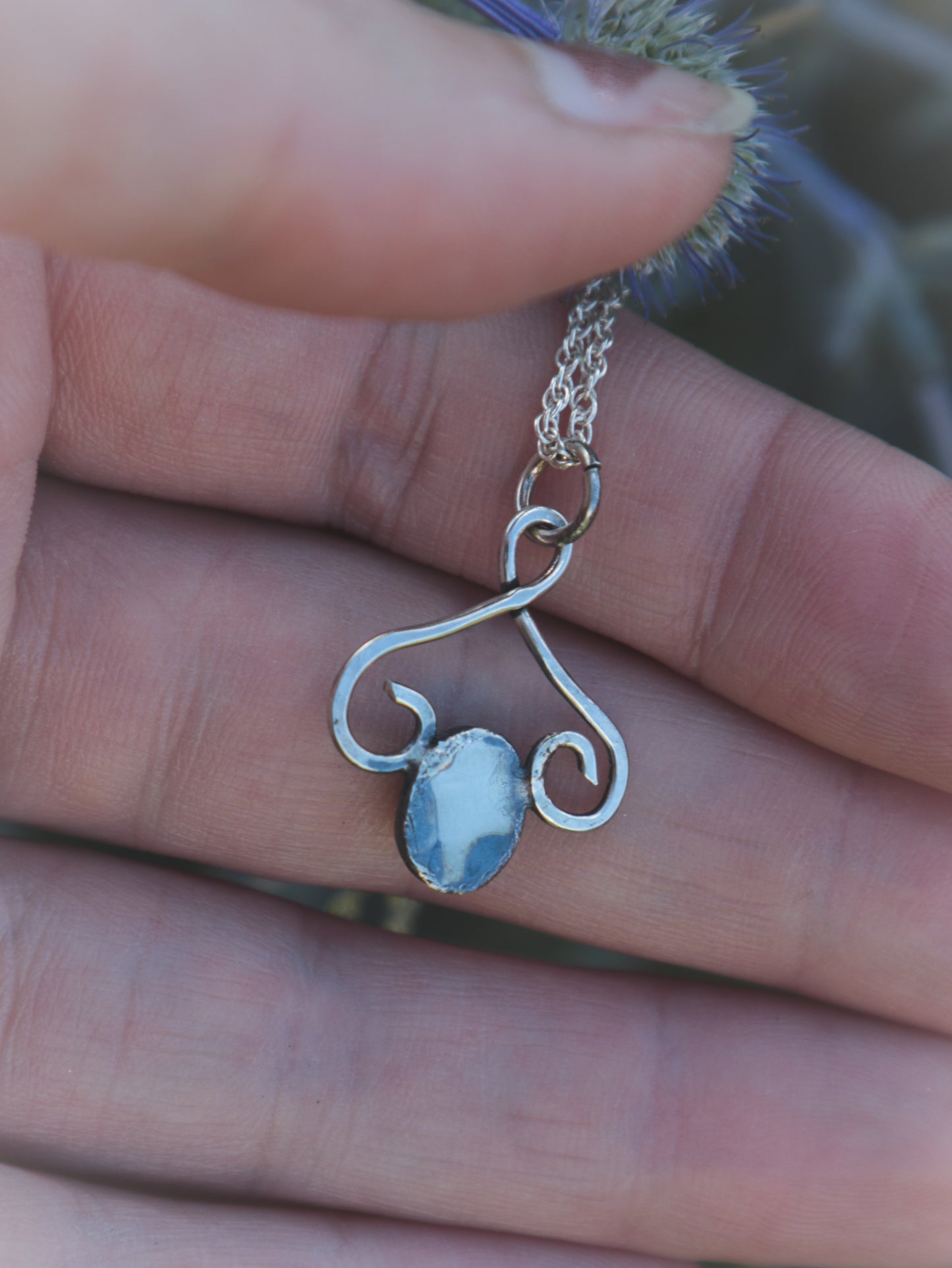 Dark Amethyst flourish necklace.