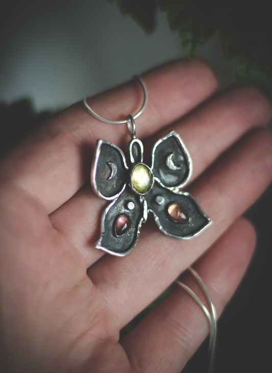 Butterfly necklace with Peridot and Tourmaline.