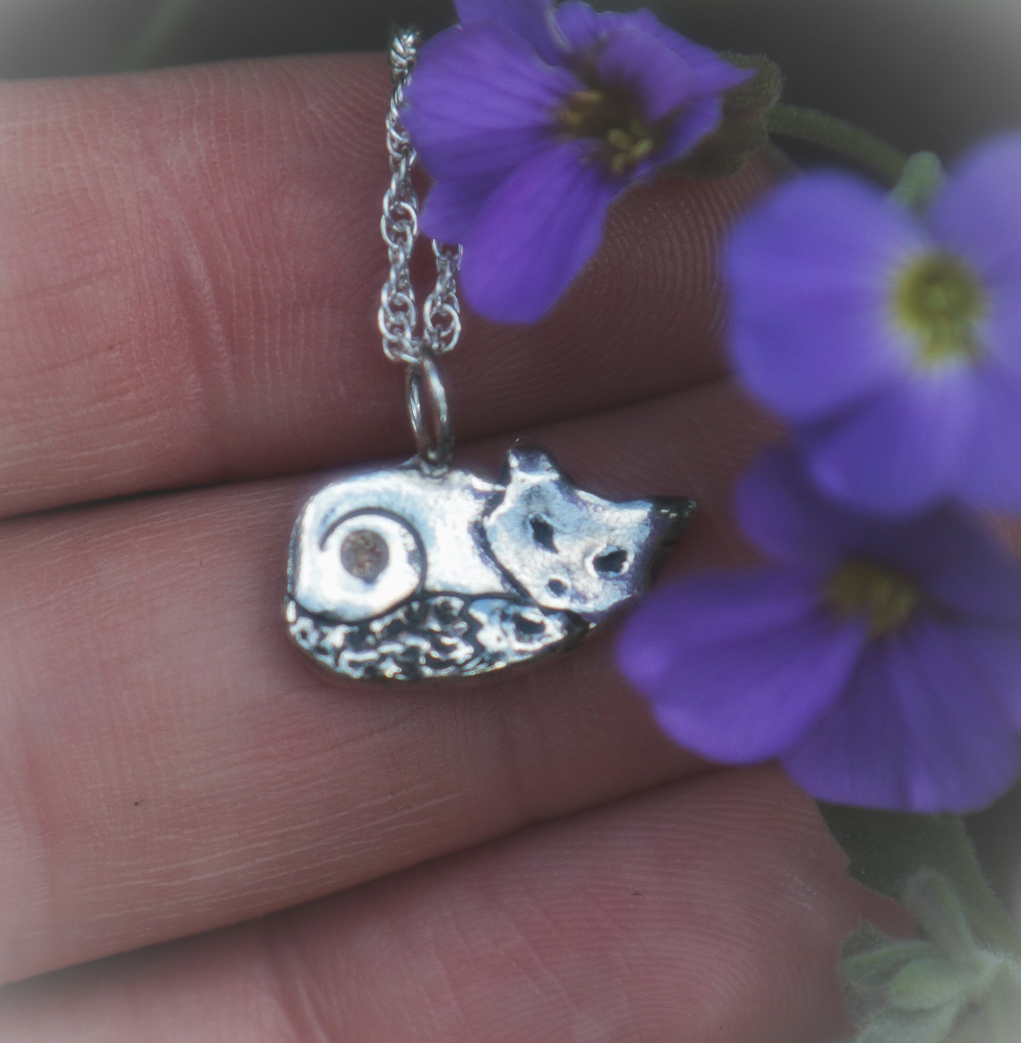 A cute sleeping fox necklace, with Cubic Zirconia