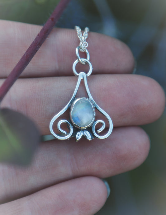 Moonstone flourish necklace.