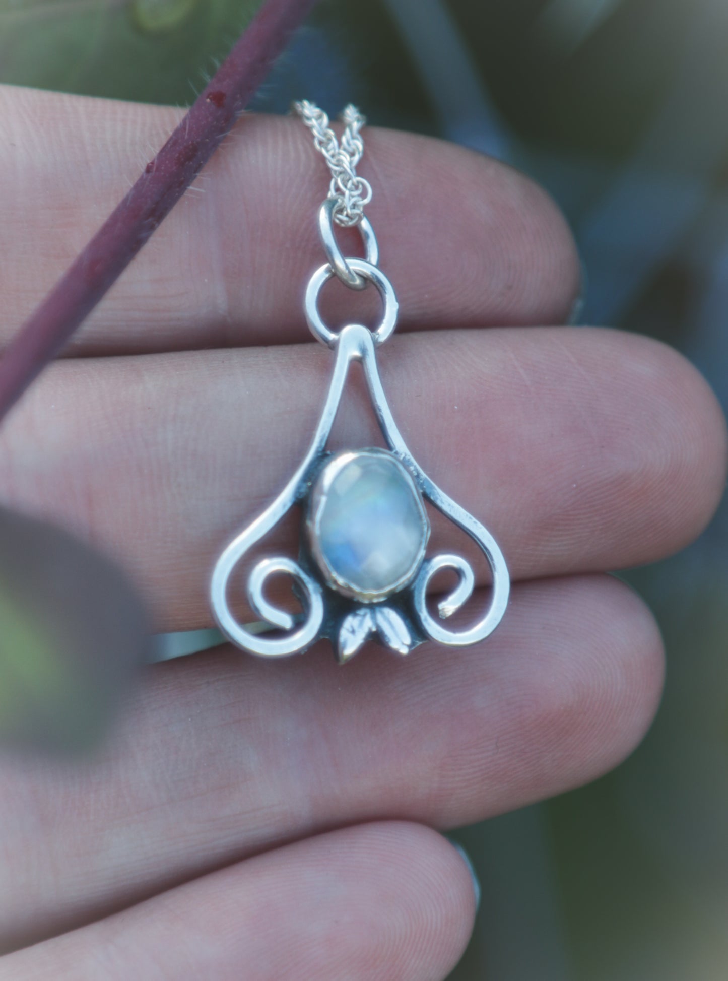 Moonstone flourish necklace.